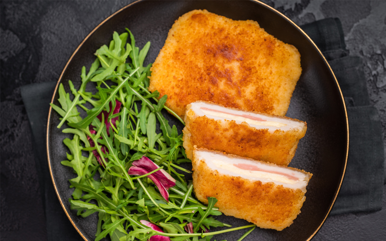 Cordon Bleu-style turkey served on a salad of arugula and sun-dried tomatoes with a Dijon mustard dressing