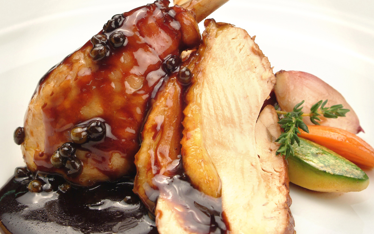 Roasted guinea fowl thighs served on a flavorful truffle puree, with confit vegetables (zucchini, carrots, Jerusalem artichoke) and a roast sauce (demi-glace) with green pepper